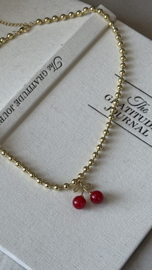 Collar de Balin mas cerecita roja y zirconitas